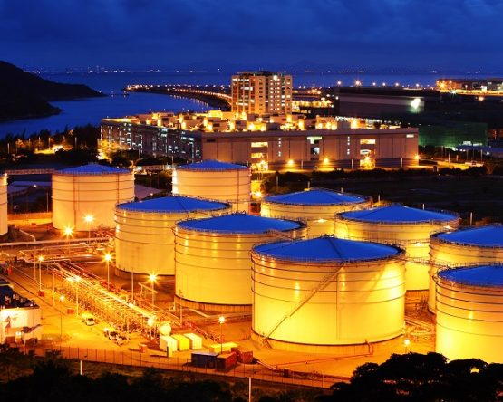 Oil refinery facility at night